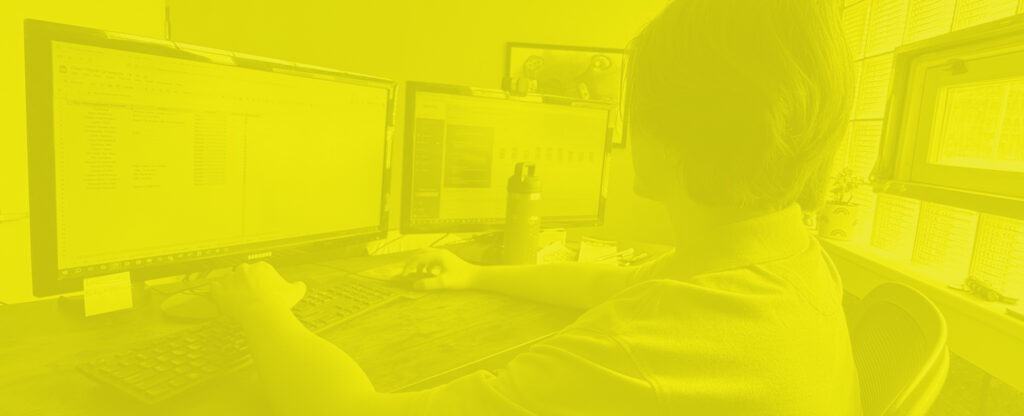 Image of RoShamBo Creative employee working on computer.