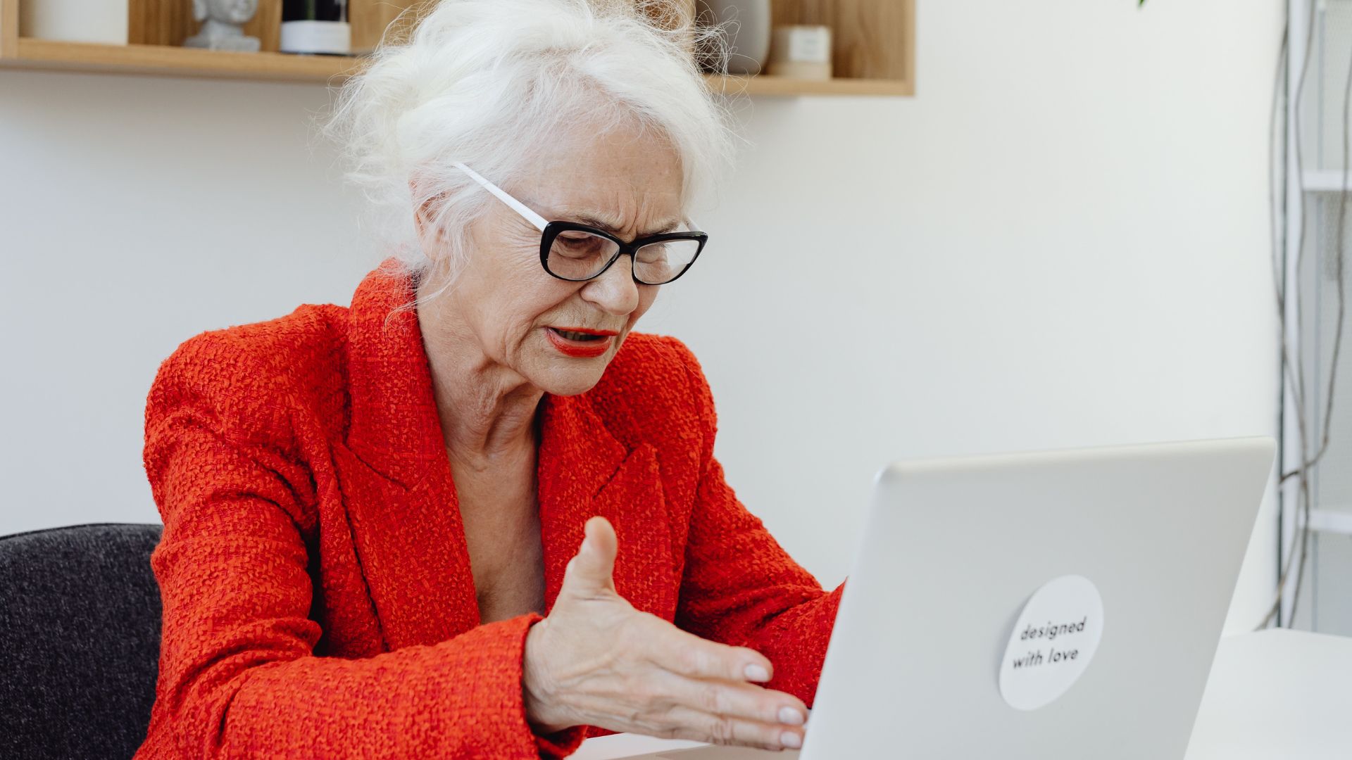 Older women frustrated at laptop.