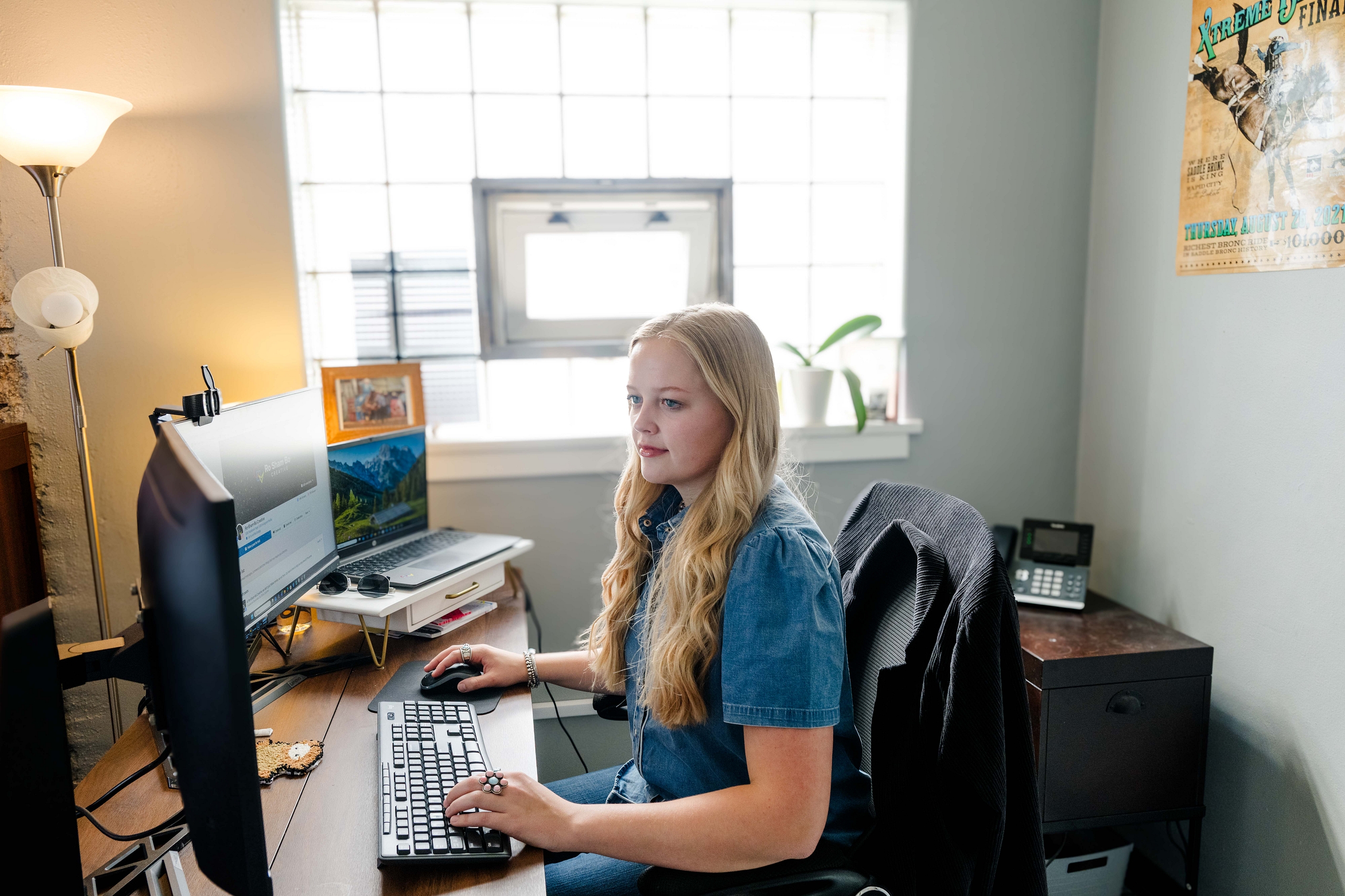 Image of Sam working at her desk