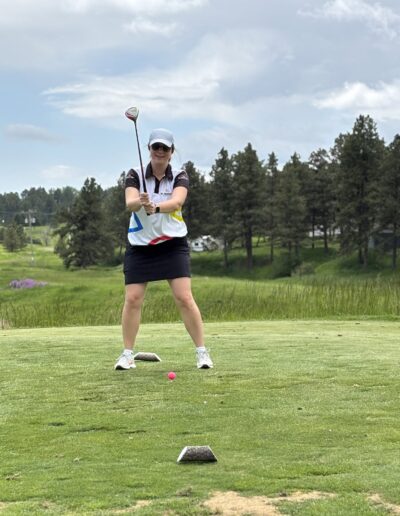Image of Shanna golfing at Kieffer Sanitation Golf Tournament