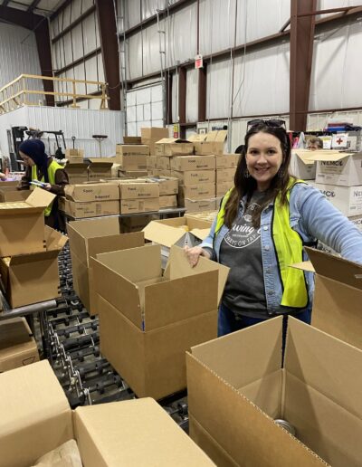Lauren packing food at Feeding South Dakota