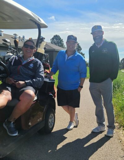 RoShamBo crew and family on golf cart