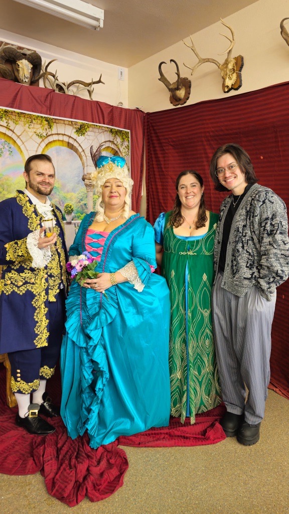 Image of Kandi and Vincent with volunteers at Black Hills Symphony's annual Bridgerton Brunch event